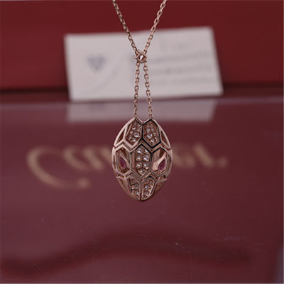 Qualidade A colar de Roman Serpenti em 18 kt aumentou ouro ajustado com olhos do rubellite e com os diamantes do pavé na cabeça fábrica